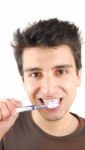 Cute Guy Washing His Teeth Stock Photo