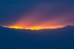 Last Light Of Sky Over Mountain Stock Photo