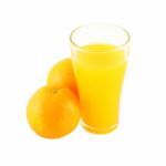 Glass Of Orange Juice And Two Fruit Side On White Background Stock Photo