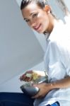 Woman Eating Salad At Home Stock Photo