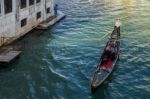 Gondolier Plying His Trade On The Grand Canal Venice Stock Photo