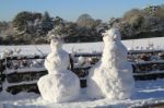 Snowman And Woman Stock Photo