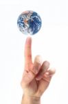 Earth On Finger Stock Photo