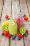 Fresh Blended Fruit Smoothies In Vintage Milk Bottles Stock Photo