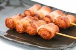 Fried Sausage Rolled With Bacon Stock Photo