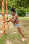 Young African Woman Doing Stretching Stock Photo