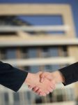 Handshaking Business People Stock Photo