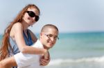 Man Piggyback His Girlfriend Stock Photo