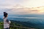 Woman Tourist Watching The Sunrise Stock Photo