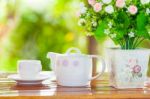 White Porcelain Set For Tea Or Coffee On Wooden Table Stock Photo