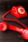 Retro Vintage Red Landline Unhang On Wooden Background Stock Photo