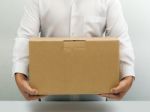 Carrying Brown Cardboard Box Stock Photo