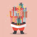 Santa Claus Holding A Pile Of Gift Boxes Stock Photo