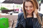 Young Woman Enjoying At Cafe Stock Photo