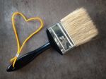 Paint Brush With A Yellow Rope Stock Photo