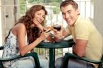 Laughing Couple Toasting Stock Photo