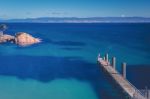 Freycinet Pier By Coles Bay In Tasmania Stock Photo