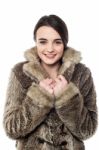 Stylish Young Girl In Fur Jacket Stock Photo