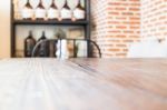 Wooden Table And Bottle Of Essential Oil Stock Photo