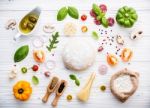 The Ingredients For Homemade Pizza On White Wooden Background Stock Photo