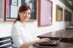 Portrait Of Thai Adult Businesswoman Beautiful Girl Using Computer Notebook Stock Photo