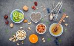 Ingredients For A Healthy Foods Background, Nuts, Honey, Berries Stock Photo