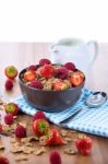 Bran Flakes With Fresh Raspberries And Strawberries And Pitcher Stock Photo