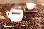 Cups With Coffee And Coffee Beans Stock Photo