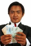 Smiling Businessman Holding Euros Stock Photo