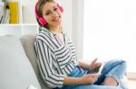 Beautiful Young Woman Listening To Music With Digital Tablet Stock Photo