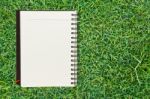 Notebook On Grass Stock Photo