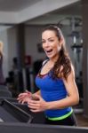 Beautiful Brunette On A Treadmill Stock Photo