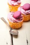 Pink Berry Cream Cupcake With Macaroon On Top Stock Photo