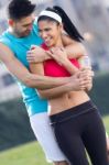 Young Couple In The Park After Exercise Stock Photo