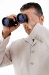 Man Looking Through Binocular Stock Photo