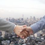 Businessmen Shaking Hands Stock Photo