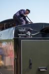 Fireman On U Class Locomotive At East Grinstead Station Stock Photo