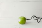 Green Apple Connected To An Ethernet Cable Stock Photo