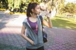 Portrait Of Young Beautiful Woman In Sport Wearing Drinking Wate Stock Photo