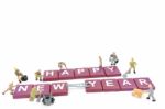 Miniature Worker Team Building Word Happy New Year On White Background Stock Photo