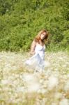 Young Woman In Meadow Stock Photo