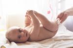 Mom Carefully Clean Baby Skin With Wet Wipes Stock Photo