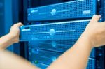 Man Fix Server Network In Data Center Room Stock Photo