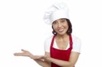 Smiling Asian Female Chef Gesturing Stock Photo