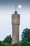 Water Tower With Full Moon In Evening Stock Photo