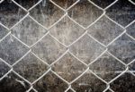 Fence And Grunge Wall Stock Photo