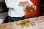 Cropped Image Of A Chef Preparing Pizza Stock Photo