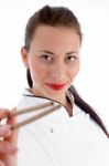 Young Chef Holding Chopsticks Stock Photo