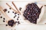 Coffee Beans On Wood Table Stock Photo