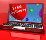 Free Delivery Balloons On Computer Showing No Charge Or Gratis T Stock Photo